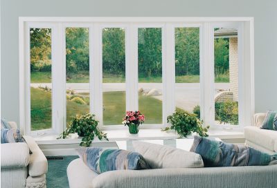 Inside view of bow windows overlooking landscaping